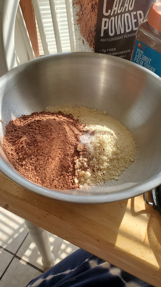 1. Preheat the oven to 350 °F (175 °C) and line an 8"×8" (20cmx20cm) pan with parchment paper. 2. In a medium mixing bowl, stir together the flour, cocoa powder, and salt. Set aside. 3. In a large mixing bowl, stir together the melted butter or coconut oil, sugar, and vanilla extract. Once combined, add the eggs one at a time, and stir just until combined (don't use a hand mixer like in the video!). 4. Add the dry mixture to the wet and stir just until almost no streaks of flour remain. Do not overmix! Fold in 3/4 cup (128 grams) chocolate chunks (I used dark chocolate chips and they tasted great). 5. Pour the batter into the prepared pan and sprinkle the 1 cup mini chocolate chips on top. 6. Bake for 23 minutes. The brownies will puff up a little bit and may crack a little bit around the edges and the top will appear dry and crisp (not at all wet). When you remove it from the oven and tilt the pan, it may appear to move a little but shouldn't look super jiggly. A toothpick inserted into the center will come out wet. A toothpick inserted into the sides will come out with some moist crumbs on it, but not totally raw batter. The brownies will continue to bake as they sit in the pan and will firm up as they cool.
Let cool completely and cut into squares. Cover and store at room temperature for 3 days or refrigerate for 5 days. They get firmer and have a great texture from the fridge! They can also be frozen for up to 3 months.