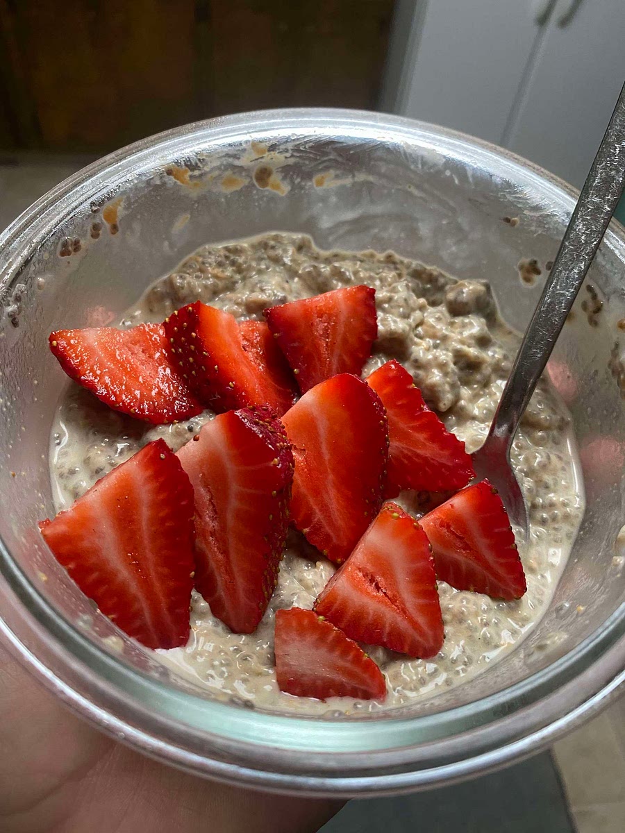 In the morning, the oatmeal will be pretty thick. Add some more almond milk to make it your perfect consistency! I like to top mine with some strawberries or raspberries 😋