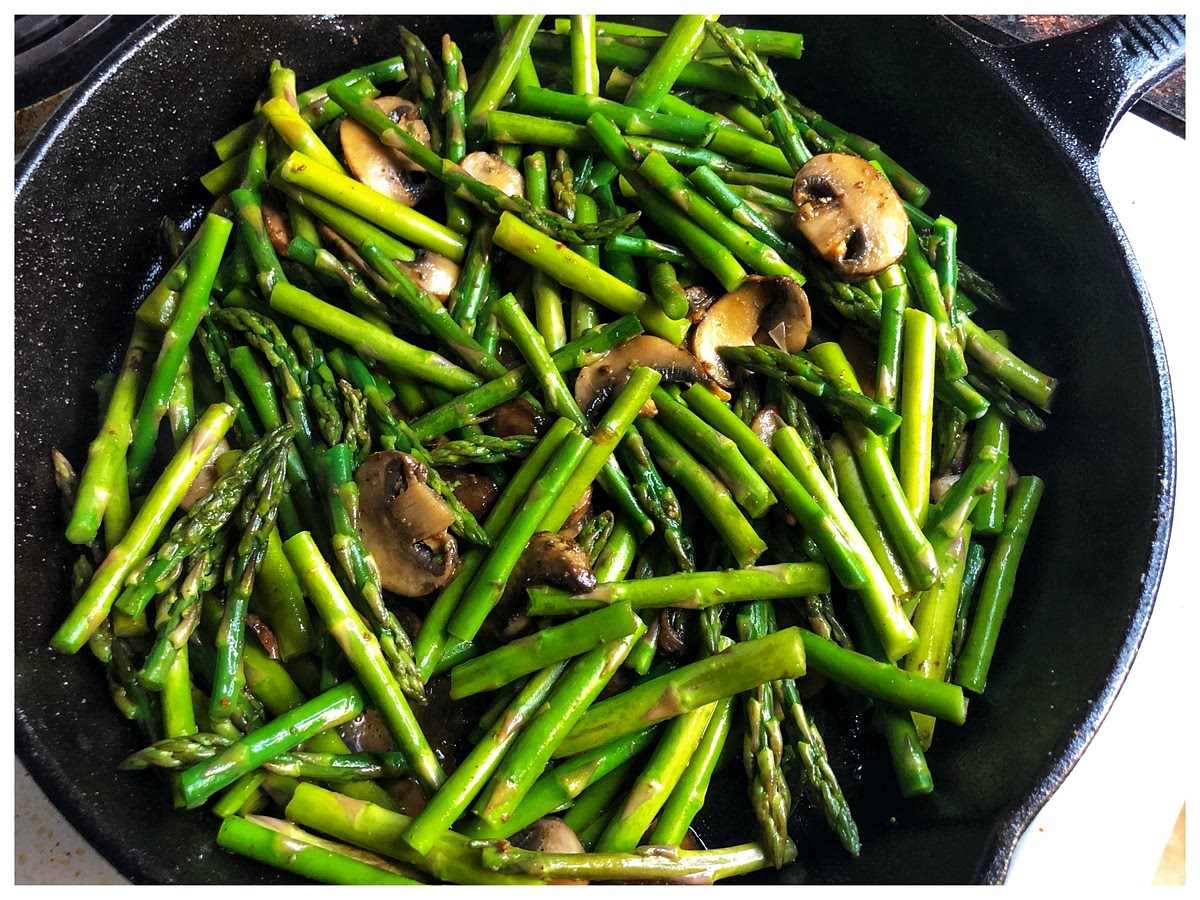 Add asparagus pieces and stir until mixed well with the mushrooms.