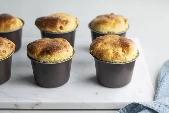 Uncover the babas and bake them until they turn golden brown and begin to pull away from the sides of the molds, 20 to 25 minutes