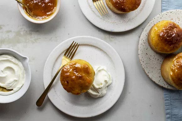 Garnish the babas au rhum with vanilla Chantilly cream to serve.