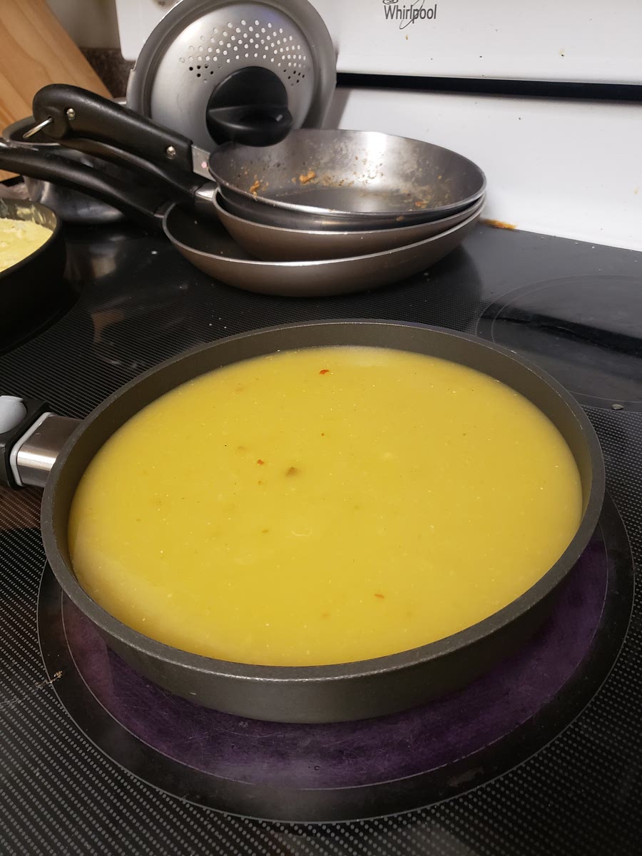 In a small skillet, bring enchilada sauce to boil. Remove from heat.