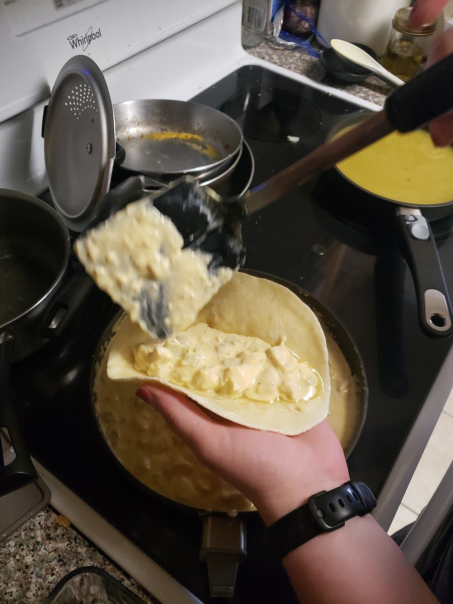 Spoon 1/3 cup of chicken mixture and 2 tablespoons sour cream down center for each tortilla.