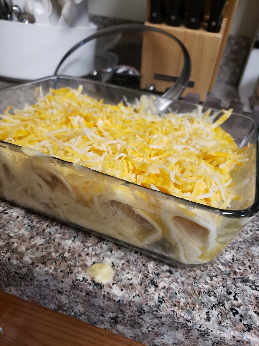 Repeat with the remaining tortillas. Pour remaining heated enchilada sauce over top. Sprinkle with remaining 1 cup cheese.