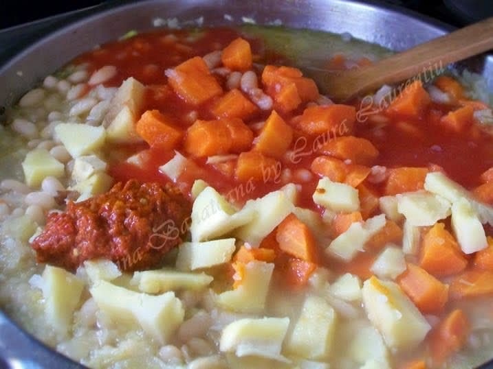 Add the diced carrots and parsnips, pepper paste and tomato paste.