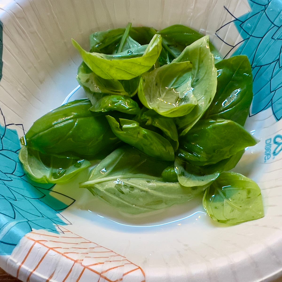 Bake for 12-15 minutes until cheese is bubbly and crust is browned...
Top with the basil leaves after about 6-7 minutes.