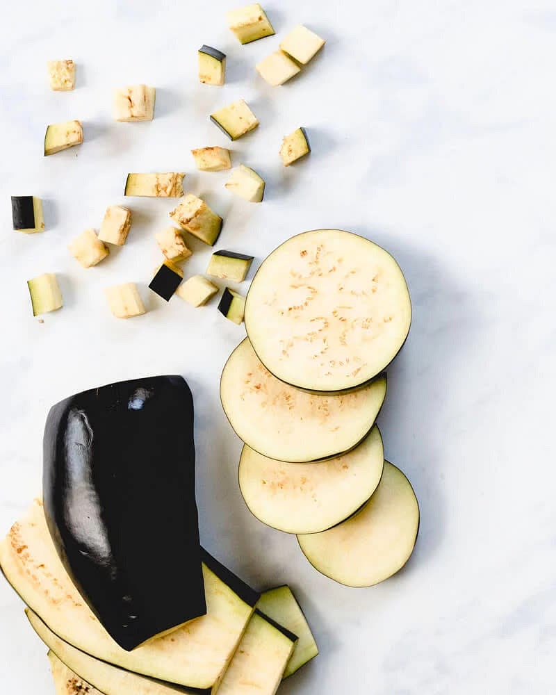 Cut the eggplant into small squares Heat up some oil in a pan Add the eggplant and onions Cook on medium heat until the edge start getting light brown Add suave cook for few minutes add mozzarella cheese and bake