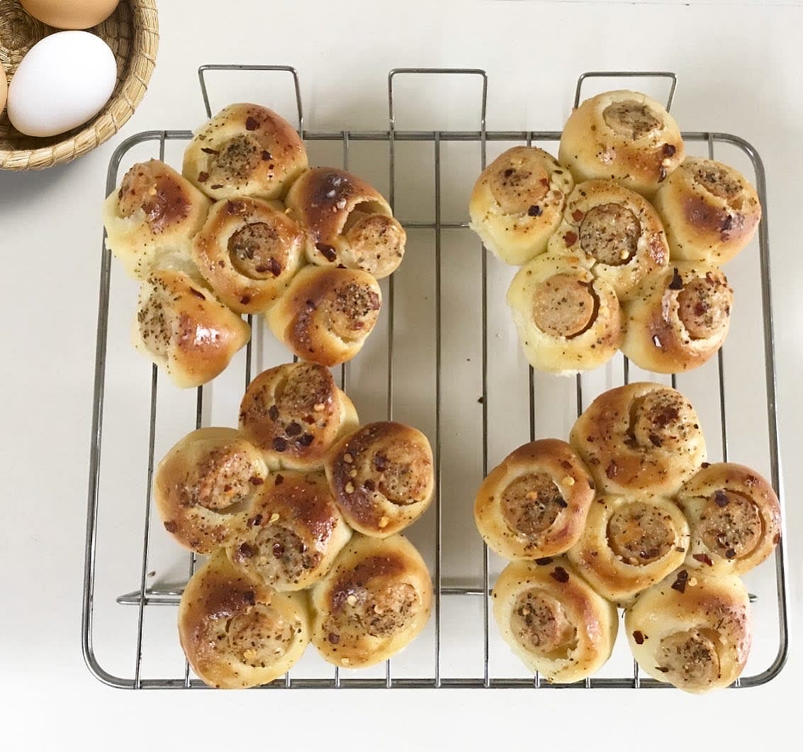 Brush the top of buns with butter and wrap them in cloth for about 15 minutes.(To retain softness)