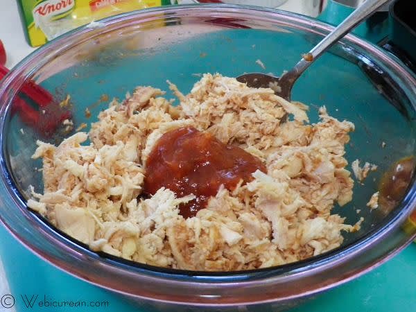 In a large bowl, thoroughly mix the chicken with the cheese, crushed garlic, and salsa. Set this aside.
