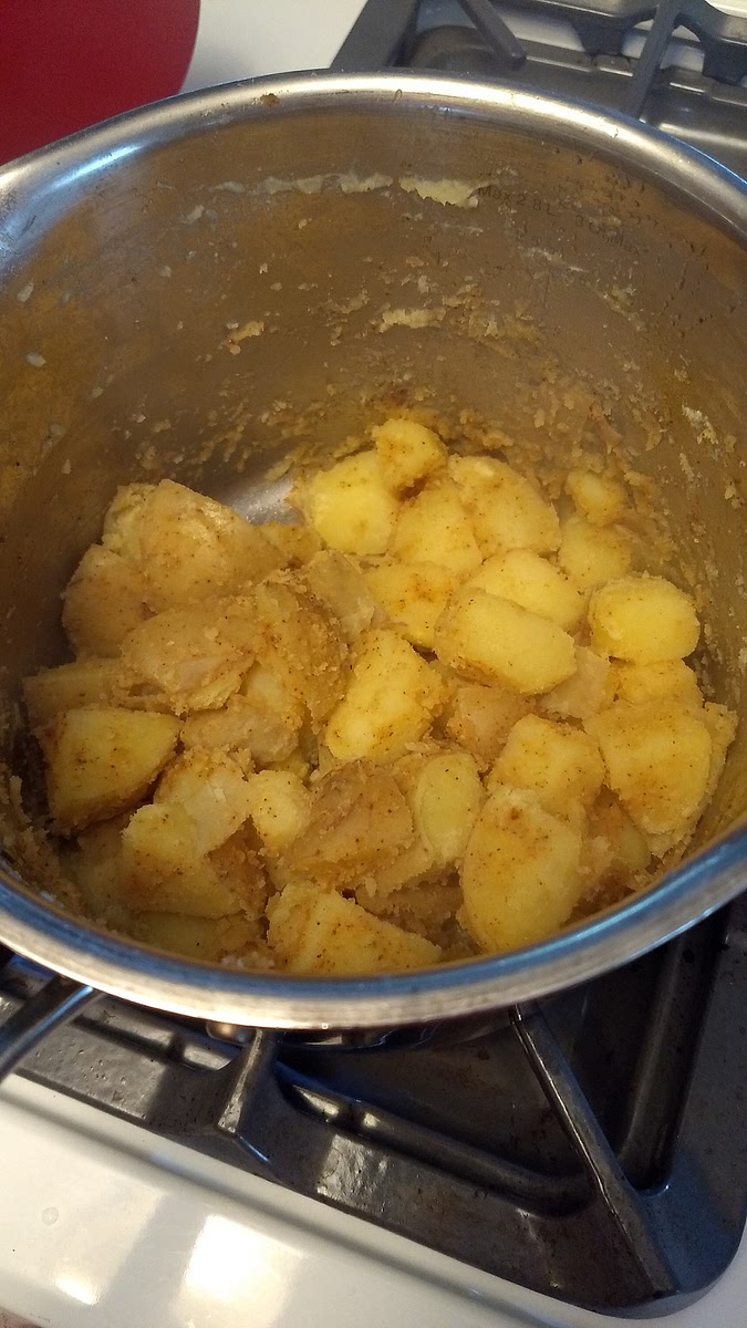 Add olive oil and seasoning. Replace lid on pot and toss vigorously until they form a light coating of mashed potato