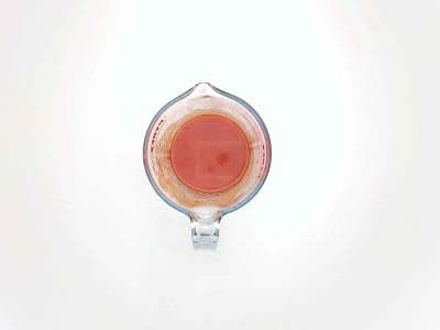 While the onion is cooking, dissolve the beef stock mix and tomato paste in 200ml [400ml] boiled water – this is your tomato stock