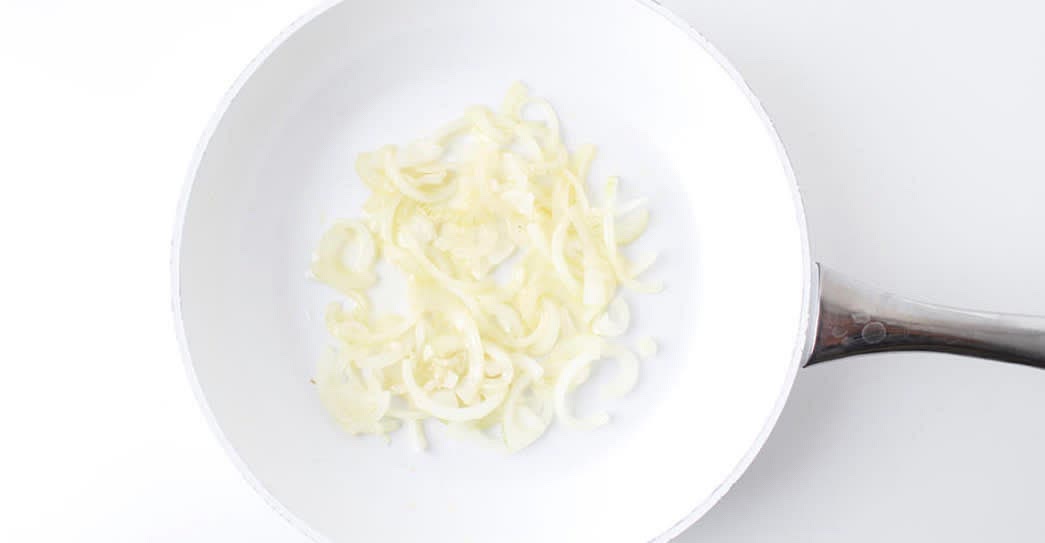 While the paneer is cooking, peel and
finely slice the brown onion s]
Return the pan to a medium heat with vegetable oil
Once hot, add the sliced onion with a
pinch of salt, sugar and cook
for 5-8 min or until soft and starting to
caramelise
Meanwhile, boil half a kettle