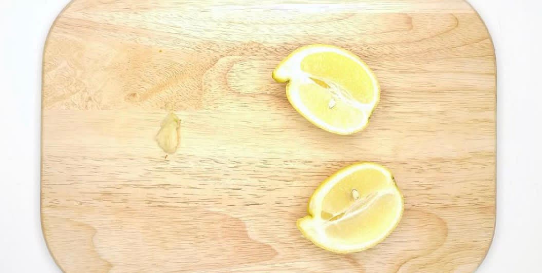 Whilst the quinoa is cooking, peel and
finely grate (or finely chop) the garlic
Cut the lemons] in half