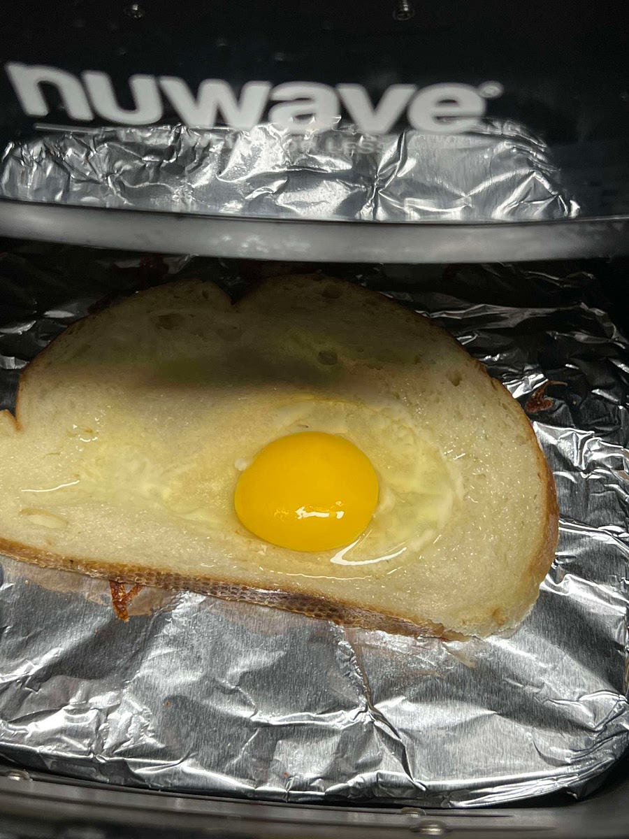 Crack egg in center of slice of bread and cook for 5 minutes