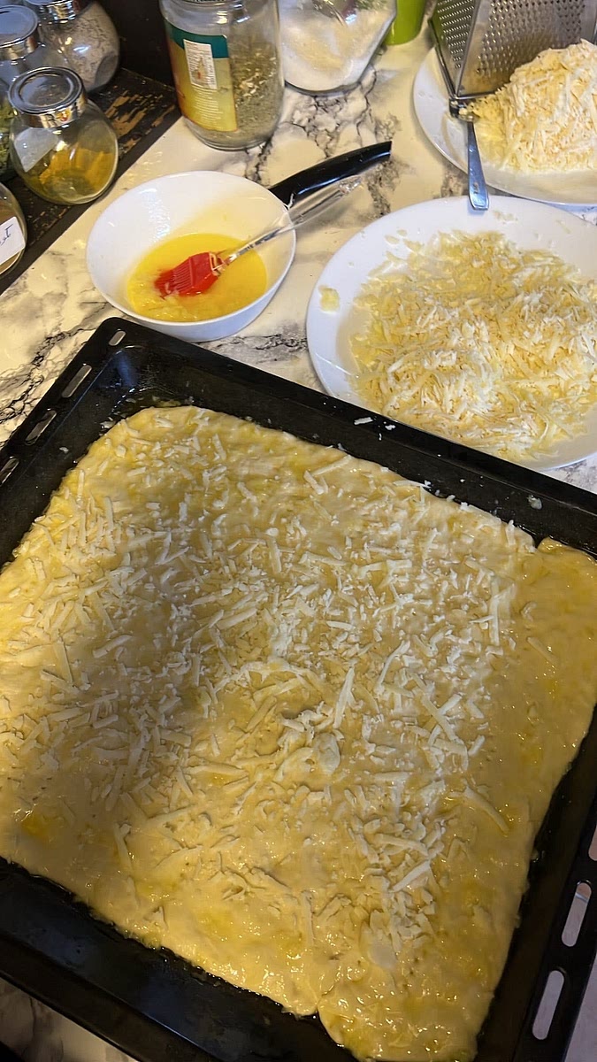 Sprinkle a small amount of cheese to the dough