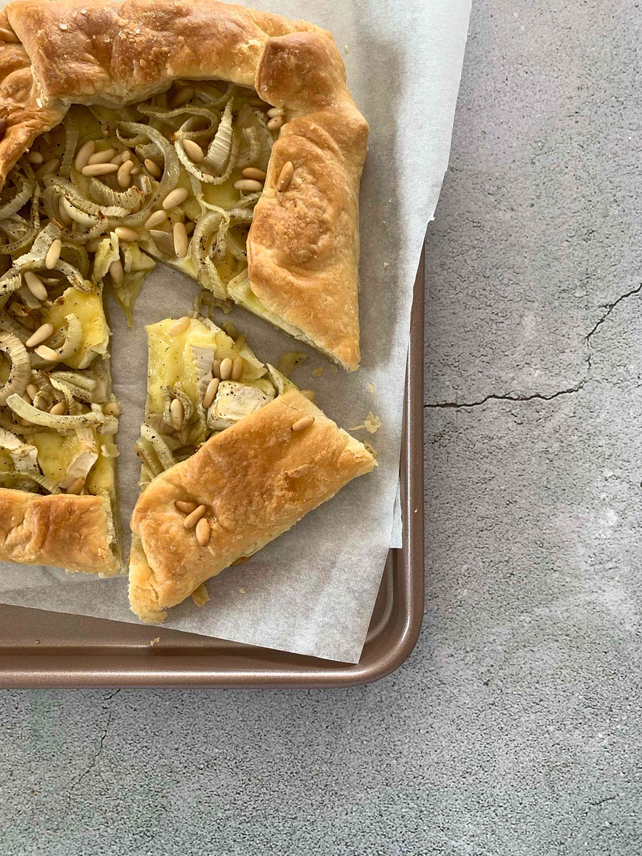 Assemble pieces of brie, chopped fennel on the sheet
