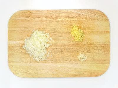 Meanwhile, boil half a kettle Peel and finely chop the brown onion[s] Peel (scrape the skin off with a teaspoon) and finely chop (or grate) the ginger Peel and finely chop (or grate) the garlic Heat a large, wide-based pan (preferably non-stick) with 1 tbsp [2 tbsp] vegetable oil over a medium heat