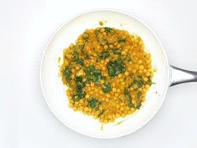 Meanwhile, add the spinach to a colander and pour boiled water all over it so that it starts to wilt Rinse the wilted spinach under cold running water until it's cool Once cool, squeeze the water out of the spinach Once the curry has thickened, add the wilted spinach and the juice of 1/2 [1] lime – this is your creamy chicken curry