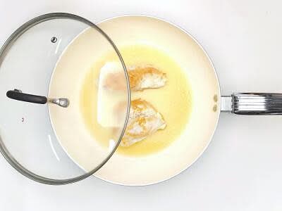 Heat a large, wide-based pan (preferably non-stick with a matching lid) with a small drizzle of olive oil over a medium-high heat Once hot, add the chicken breast portions with a pinch of salt and cook for 3 min on each side or until golden Once golden, add 250ml [500ml] boiled water to the pan, then reduce the heat to low and cook, covered, for 12-15 min or until the chicken is cooked through (no pink meat!)