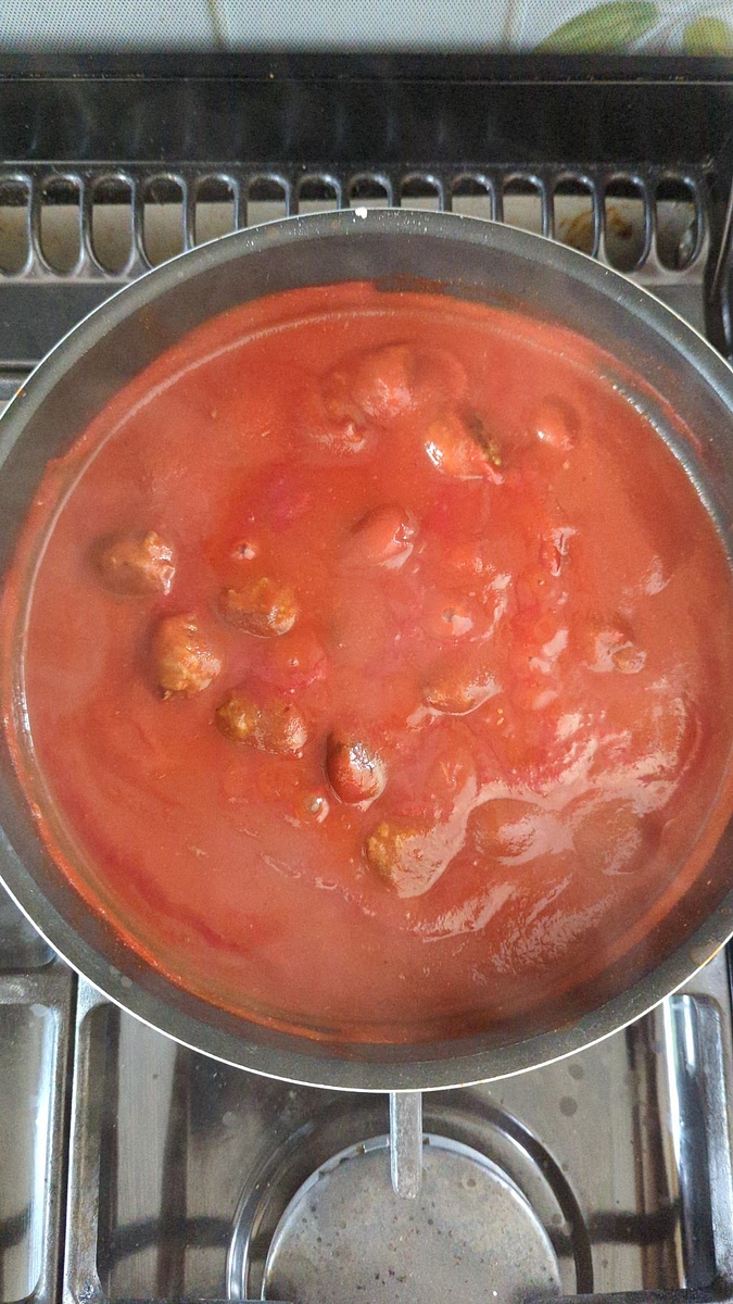 Transfer the source into a saucepan, bring up to a simmer, then add the cooked meatballs. Simmer gently for 30 minutes.