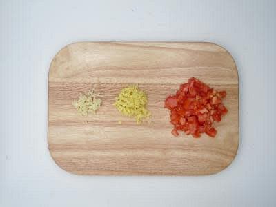 Meanwhile, peel and finely chop (or grate) the garlic Peel (scrape the skin off with a teaspoon) and finely chop (or grate) the ginger Peel (scrape the skin off with a teaspoon) and finely chop (or grate) the ginger
