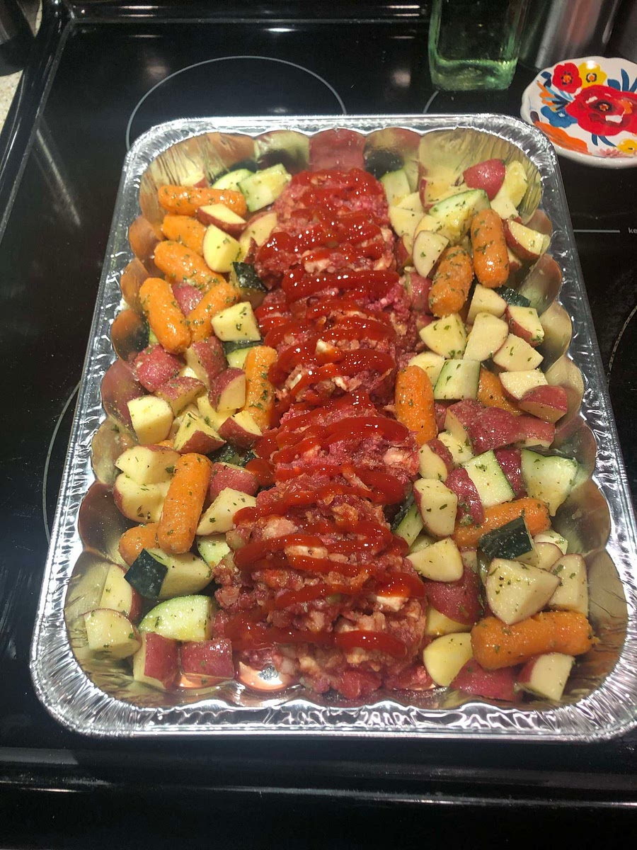 poured some ketchup across top of loaf and put cut up potato’s and carrots around loaf 350* for 1 hour or until temp is 160*