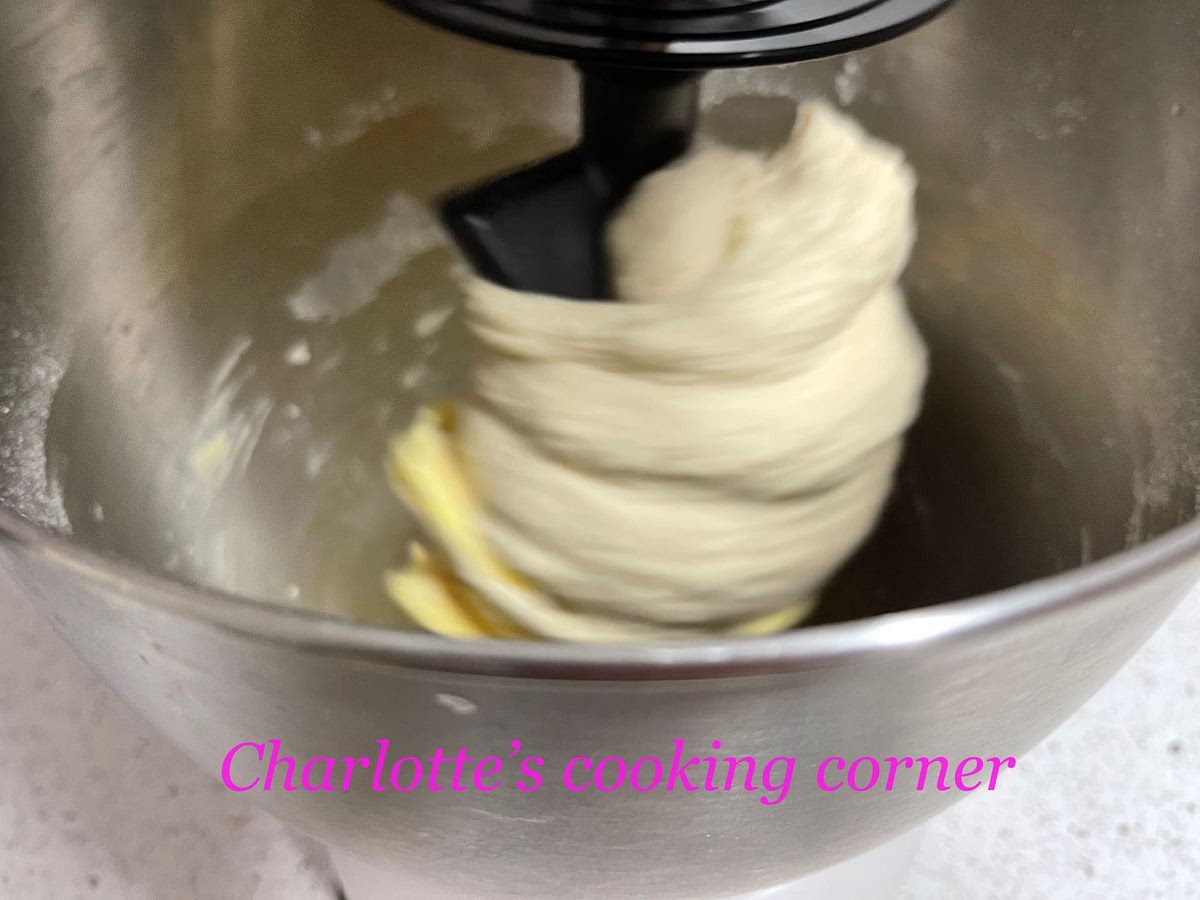 In the stand mixer, add in bread flour, water, sugar, yeast and salt. In the slow speed, beat for 2 minutes to make a dough. Add in butter, in the medium speed, beat for 5 minutes or till it's elastic. Add in sultanas, beat for 3 minutes.