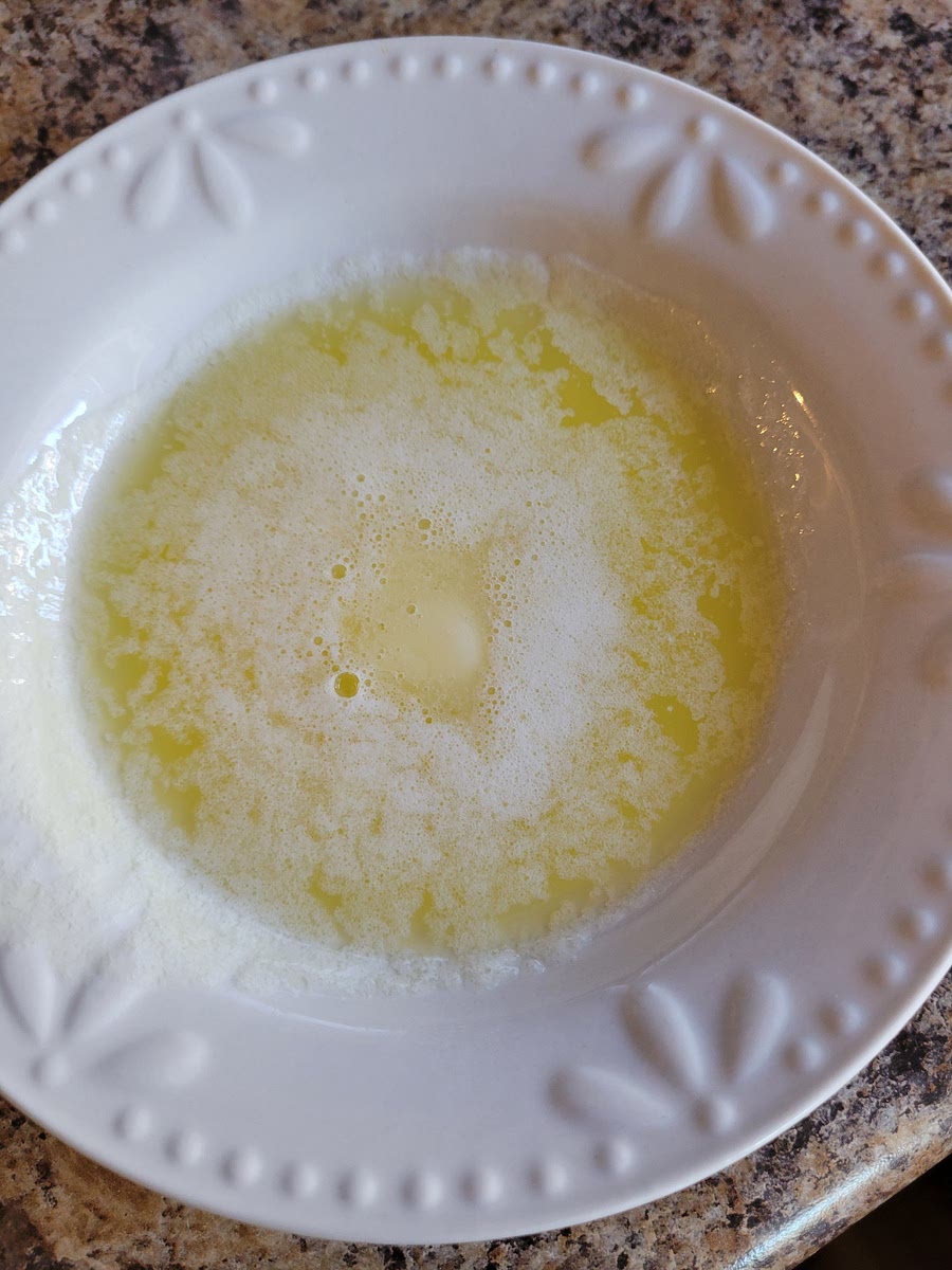 MELT 3 TBSP OF BUTTER IN THE MICROWAVE. SET ASIDE.