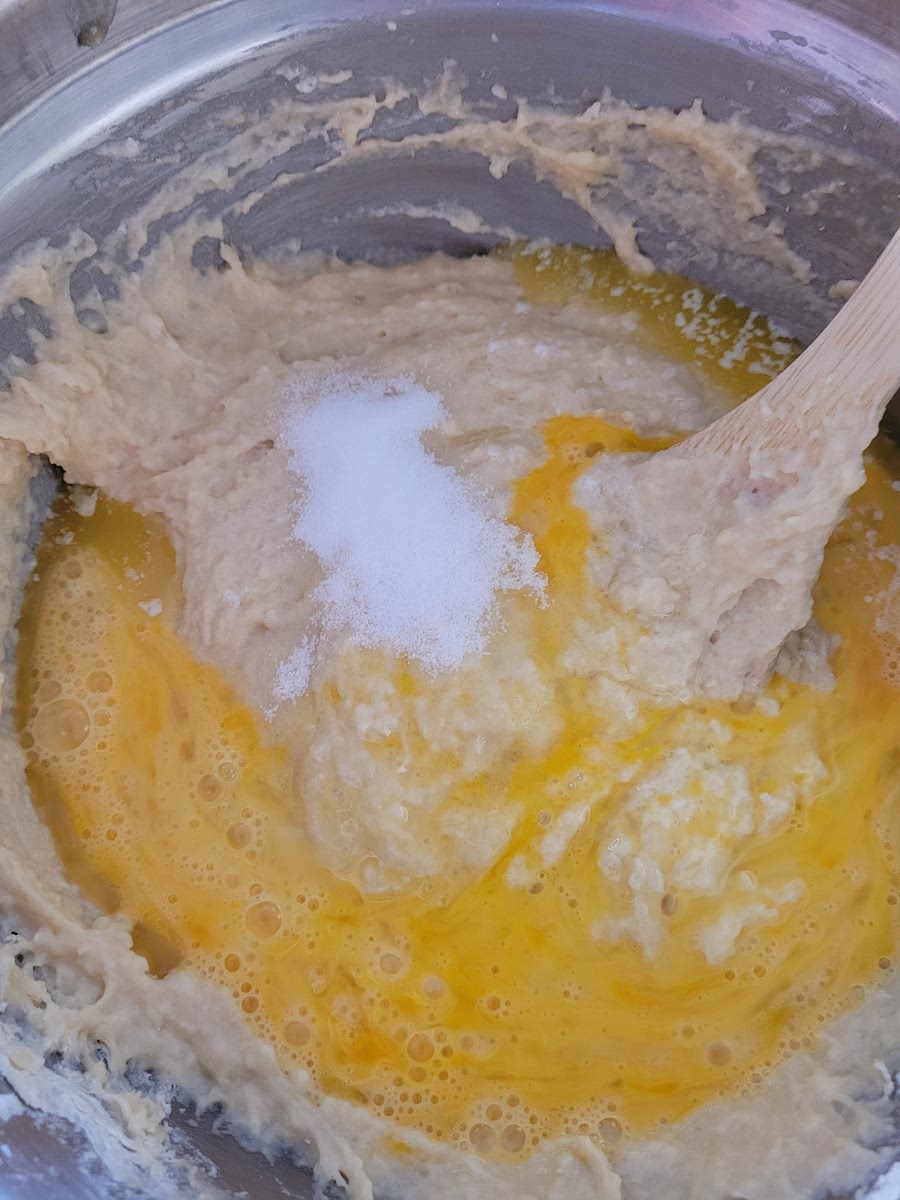 ADD MELTED BUTTER, EGGS AND SALT; MIX WELL.