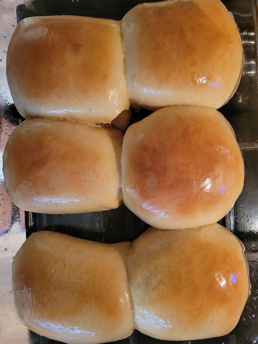 IMMEDIATELY RUB THE TOPS OF THE ROLLS WITH ADDITIONAL BUTTER. BEST SERVED WARM. STORE EXTRAS IN A ZIP-TOP BAG.