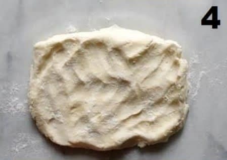 press the dough into a rectangle and roll until its about 3/4 inch thick
