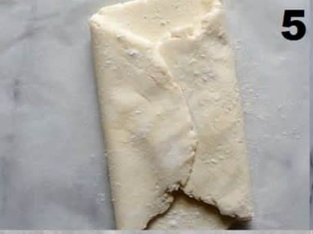 turn it vertical and fold the top into the center, then the bottom into the center.