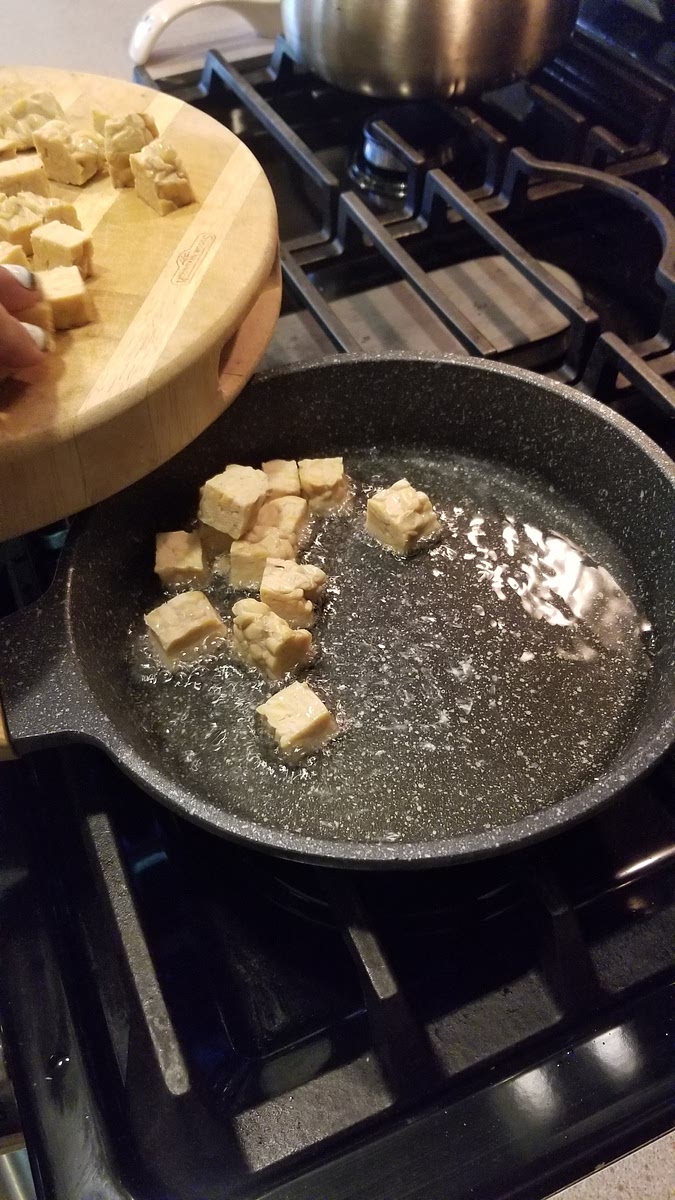 Add oil to the pan enough for the tempeh to be half submerged.