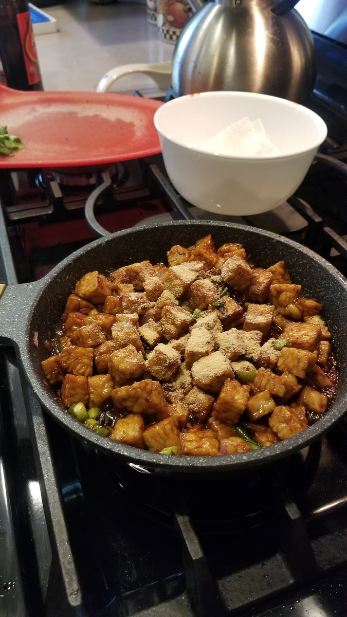 Season the tempeh with garlic powder and salt to taste.