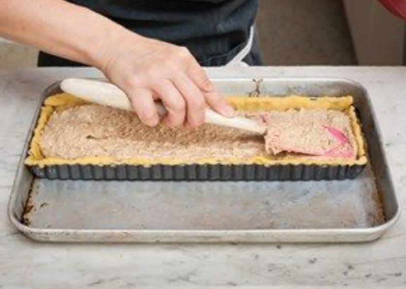 Fold in the ground pecans, lemon zest, maple syrup and a pinch of sea salt until combined. Add the mix to prepared pastry shell, decorate the tart with remaining pecans.