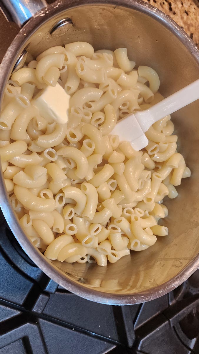 3. Put well cooked, buttered macaroni in a buttered casserole dish.