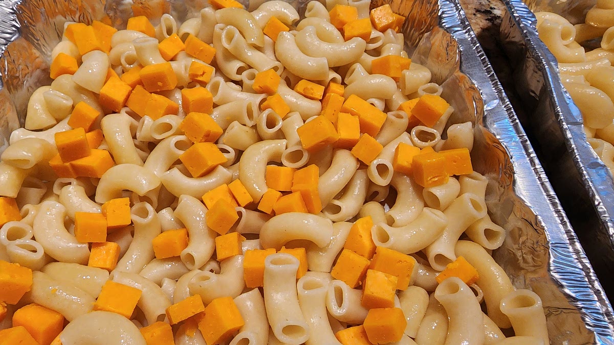 4. Mix cubed cheddar in with macaroni