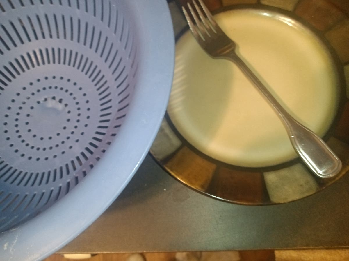 While your pastas cooking get a Plate, fork, and a strainer