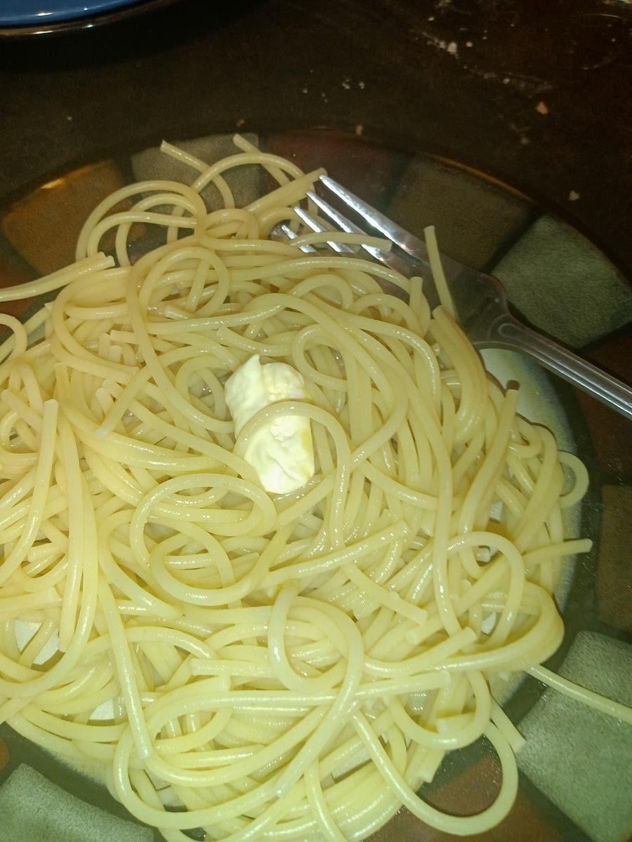 Next you're going to put your butter onto your pasta and start mixing it around to butter is fully melted