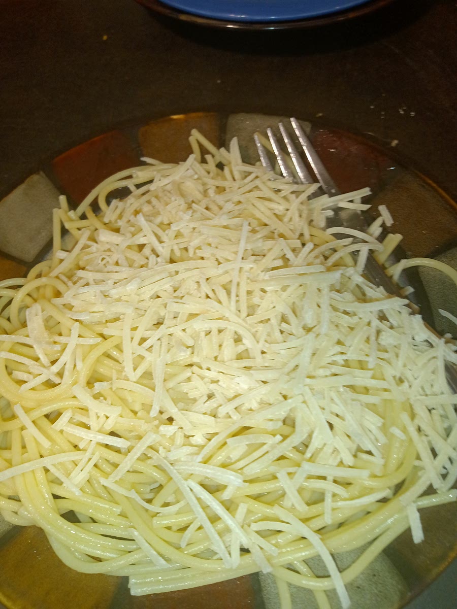 Now you are going to put your half a cup of Parmesan cheese into your pasta and mix it around until fully mixed
