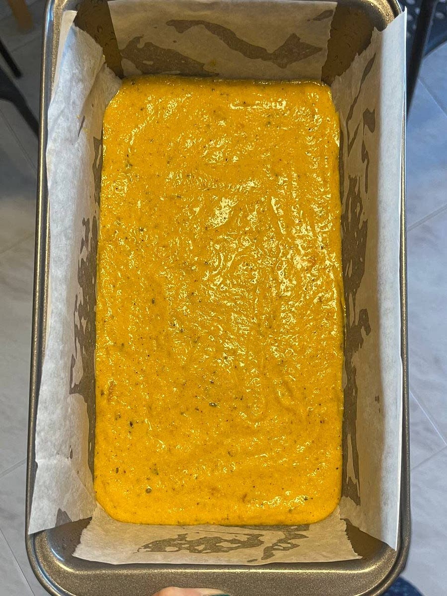 Add in the cornmeal and mix to combine. Transfer the batter to prepared loaf pan and use a spatula to even it out.