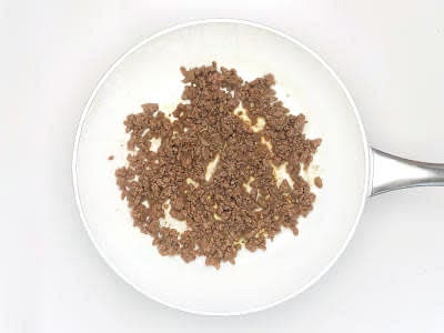 Heat a large, wide-based pan (preferably non-stick) with a drizzle of vegetable oil over a high heat Once hot, add the beef mince and sprinkle in the beef stock mix Cook for 3-4 min or until the beef has browned all over, breaking it up with a wooden spoon as you go