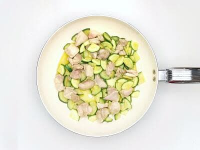 While the pasta is cooking, top, tail and chop the courgette[s] into quarters lengthways, then slice finely Heat a large, wide-based pan (preferably non-stick) with a drizzle of olive oil over a medium-high heat Once hot, add the sliced courgette and the diced chicken thigh with a pinch of salt and cook for 7-8 min or until the chicken has browned and the courgette is beginning to soften