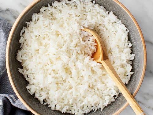 Cook rice in rice cooker until all done