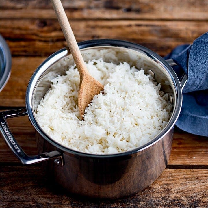 Place cooked rice in caserole add water and boil to tender, remember that rice will increase in volume once water is added so just cook as desired