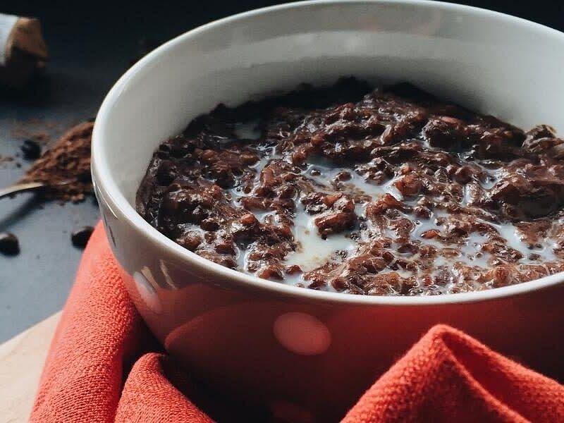 When the boiled cooked rice is sticky consistency add cocoa powder and honey or salt to taste, let it boil