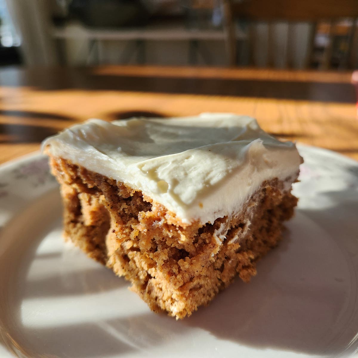 Preheat oven to 350°F. Cream butter and sugar together well. Add pumpkin, eggs and spices. Mix well. Add flour 1 cup at a time. Batter should be runny and smooth. Pour into greased and floured jelly roll pan. Bake at 350°F for 40 minutes or until the bar passes a clean toothpick test. Cool thoroughly before frosting.