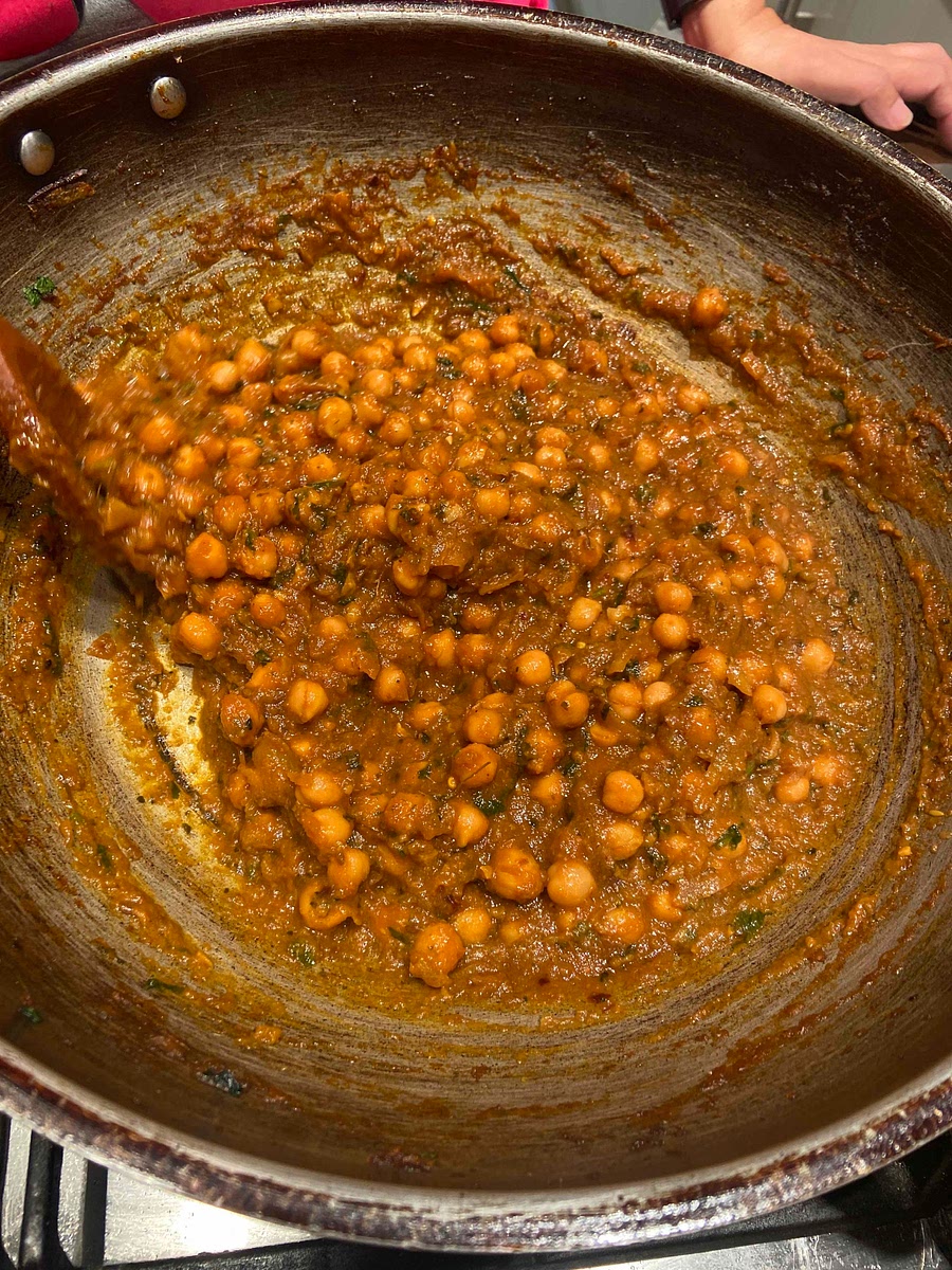 Added a handful of fresh chopped coriander and sauté for 2/3 more mins and add 300ml water to pan let simmer