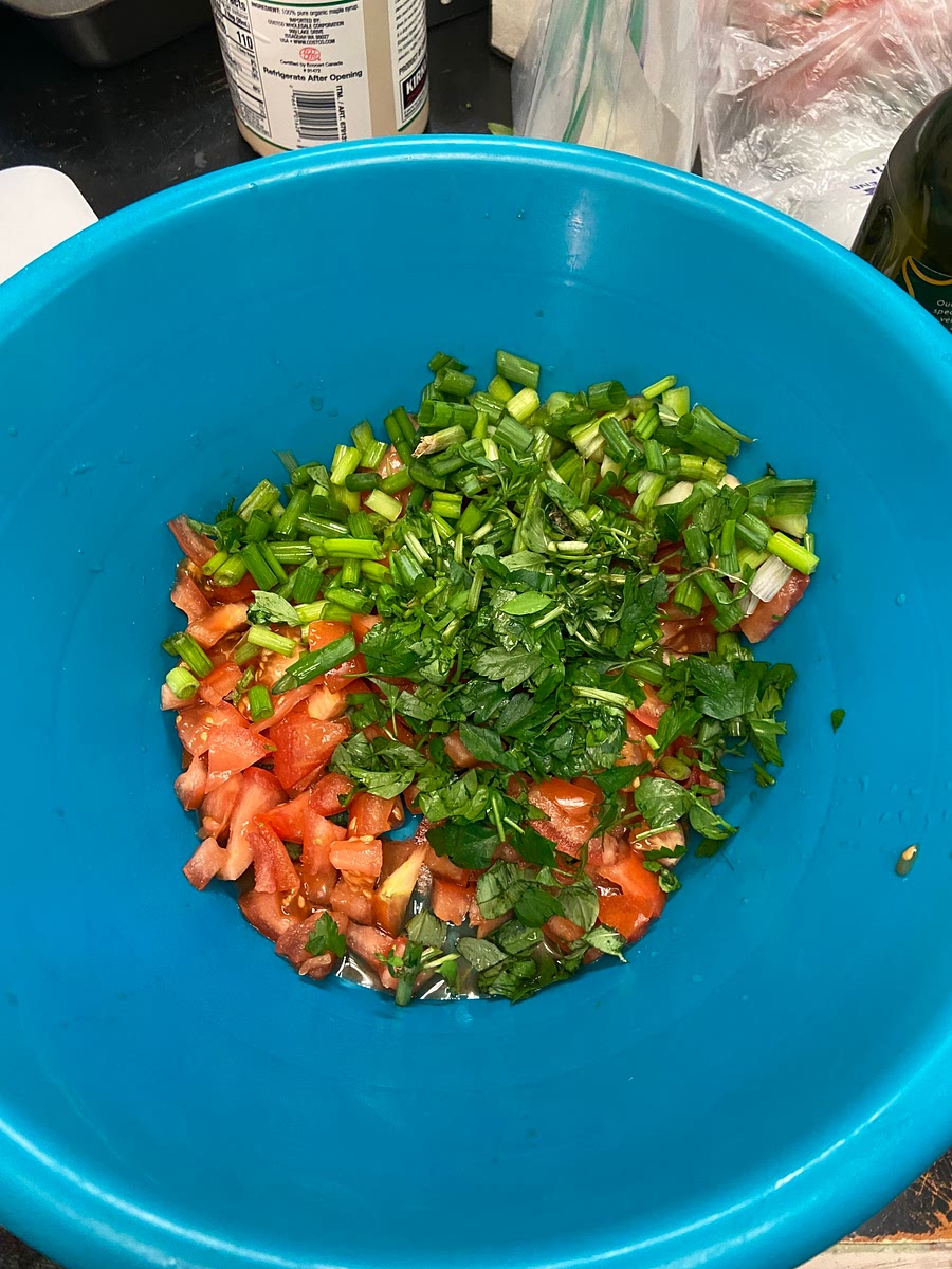 In a large bowl, combine the soaked bulgur wheat, tomatoes, scallions and parsley and toss well. Add the lemon juice, olive oil and salt and toss again. Refrigerate until ready to serve