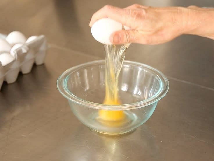 Crack egg and pour flour on the separate bowl/place